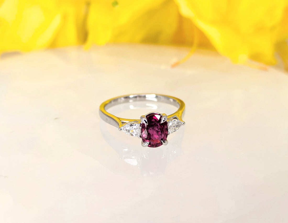 Ruby 0.918 carat natural untreated Ruby Oval in 18K white gold with 2 D-color pear shape diamonds at 0.26carats, 2.97 grams gold