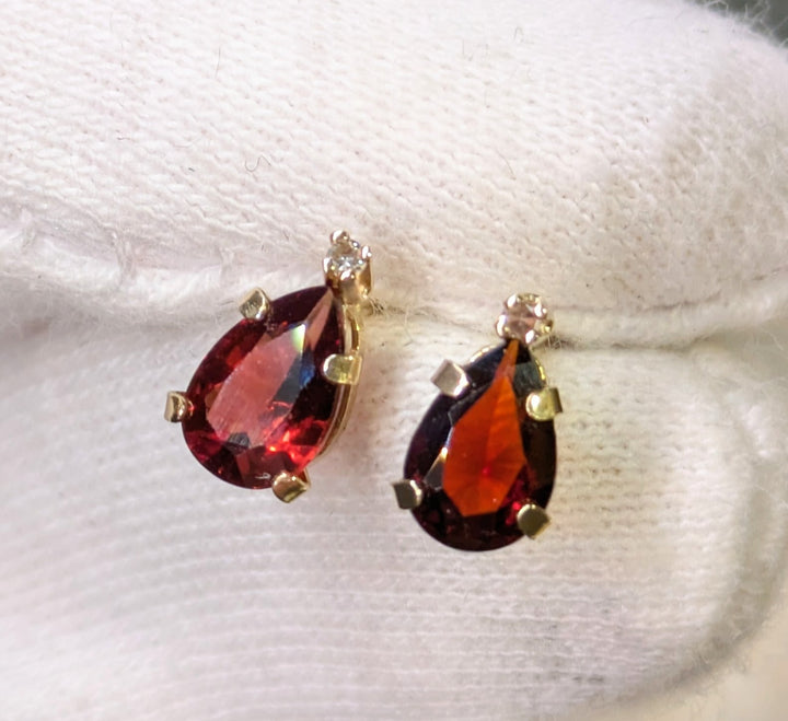 Garnet and Diamond studs 
10k yellow gold